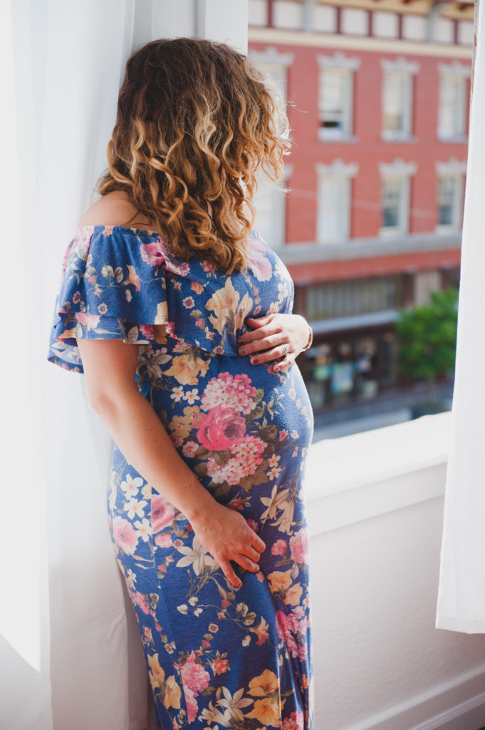 Sweet maternity photos in the studio with floral gown photographed by Tacoma Maternity Photographer Amanda Howse