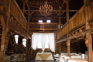 Rustic Barn Wedding Venue in Auburn with Chandeliers and String Lights Photographed by Amanda Howse
