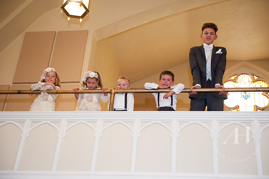 Cute flower girls and ring bearer watching church wedding Photographed by Tacoma Wedding Photographer Amanda Howse
