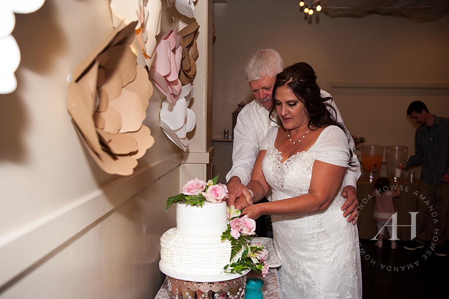 Bride & Groom cutting the cake at Events on 6th in Tacoma Photographed by Tacoma Wedding Photographer Amanda Howse