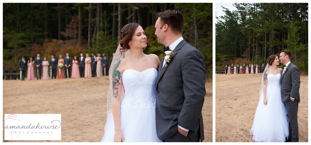 Anacortes bride and groom portraits with wedding party in the background | Photographed by Tacoma Wedding Photographer Amanda Howse