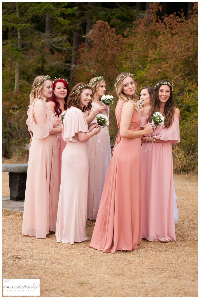 Boho bridesmaids in blush dresses with flower crowns on a beach in Anacortes | Photographed by Tacoma Wedding Photographer Amanda Howse