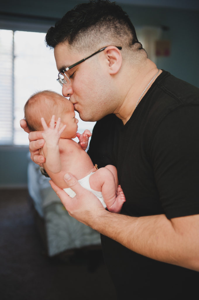 Father Holding Newborn | Essential Photos for Newborn Portrait Session | Photographed by the Best Tacoma Photographer Amanda Howse Photography