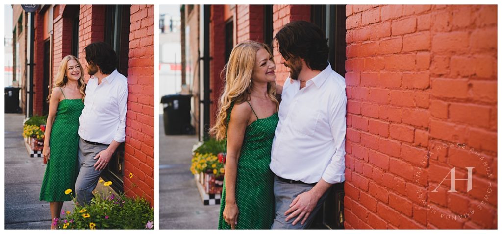 Couple Posing with Red Brick Wall in Opera Alley | Opera Alley Tacoma photograph ideas, Green and red color schema, Engagement photograph couples outfit inspiration | Photographed by the Best Tacoma Engagement Photographer Amanda Howse Photography