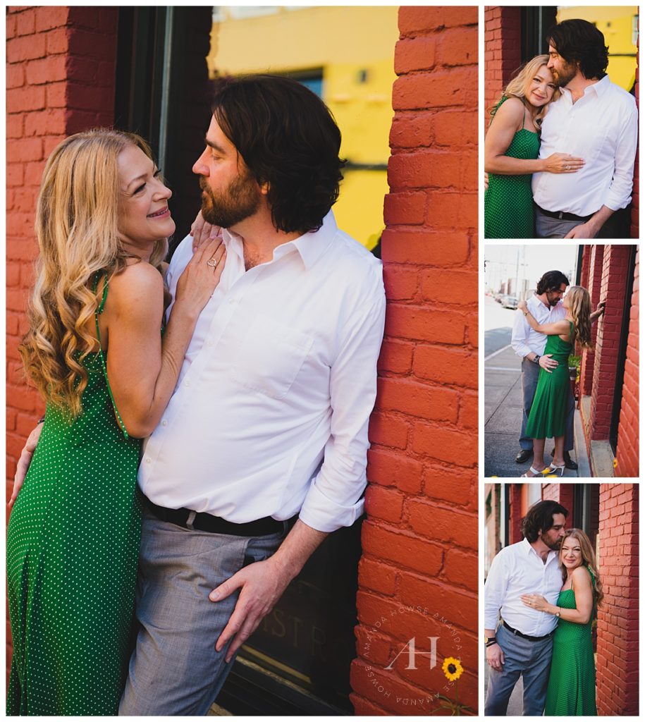 Couple Posed on Red Brick Wall | Engagement photoshoot posing ideas, Colorful Tacoma locations for engagement shots, Green summer dresses | Photographed by the Best Tacoma Engagement Photographer Amanda Howse Photography